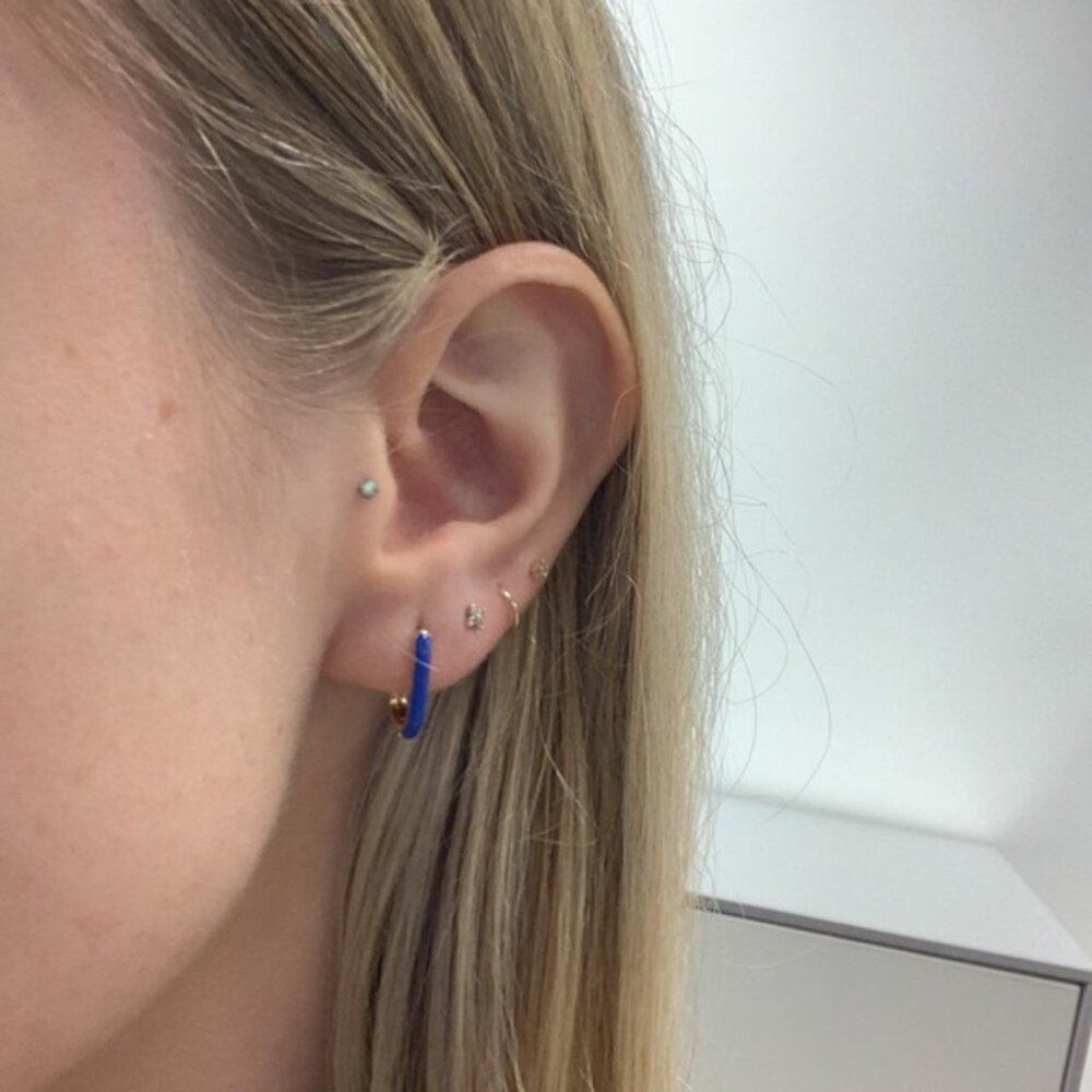 The Gia Marine gold enamel blue oval hoop earrings hoops car…